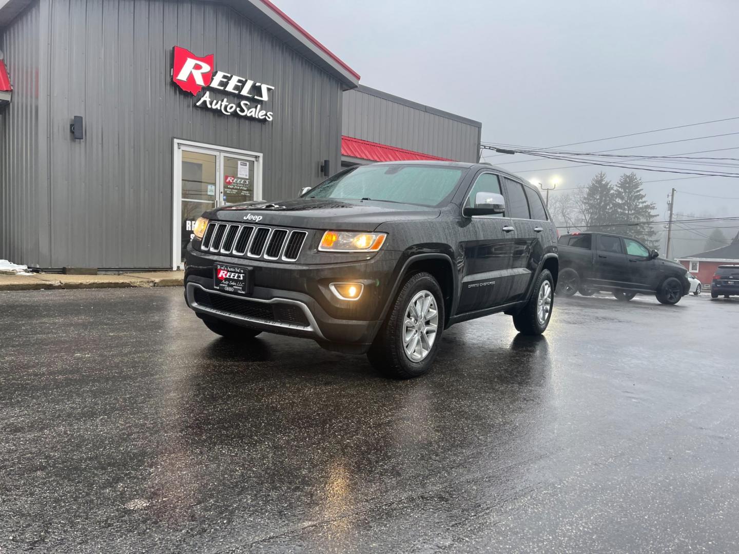 2015 Black /Black Jeep Grand Cherokee Limited 4WD (1C4RJFBG2FC) with an 3.6L V6 DOHC 24V FFV engine, 8-Speed Automatic transmission, located at 547 E. Main St., Orwell, OH, 44076, (440) 437-5893, 41.535435, -80.847855 - This 2015 Jeep Grand Cherokee Limited 4WD comes equipped with a 3.6L Pentastar V6 engine paired with an 8-speed automatic transmission, offering a blend of power and efficiency. It boasts a luxurious leather interior with both front and rear heated seats for comfort in various climates. For convenie - Photo#0